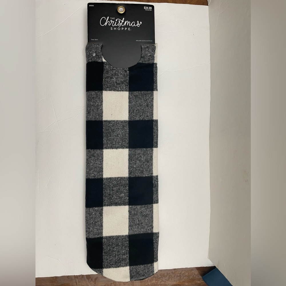 Christmas tree skirt. Black and white checkered flannel.
